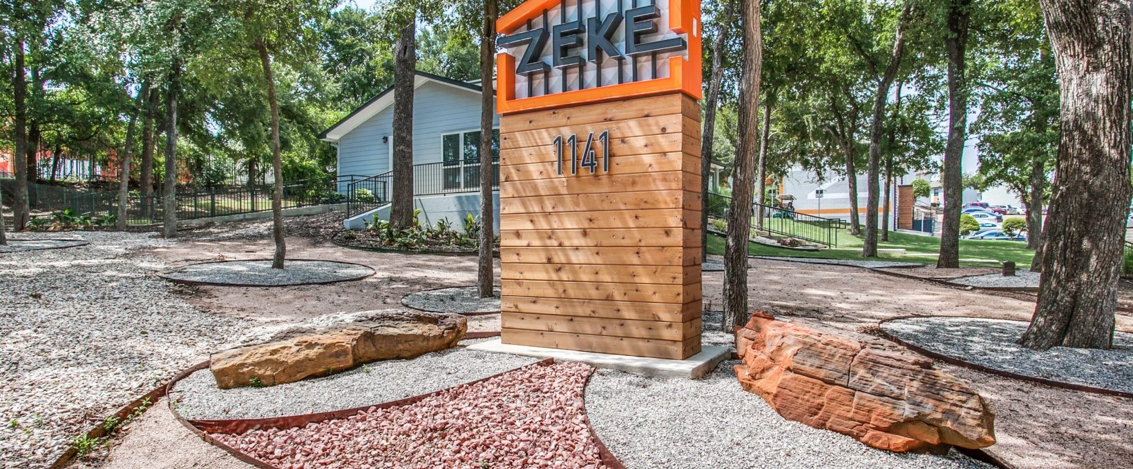 the entrance to the zikle apartment complex in austin, texas at The Zeke