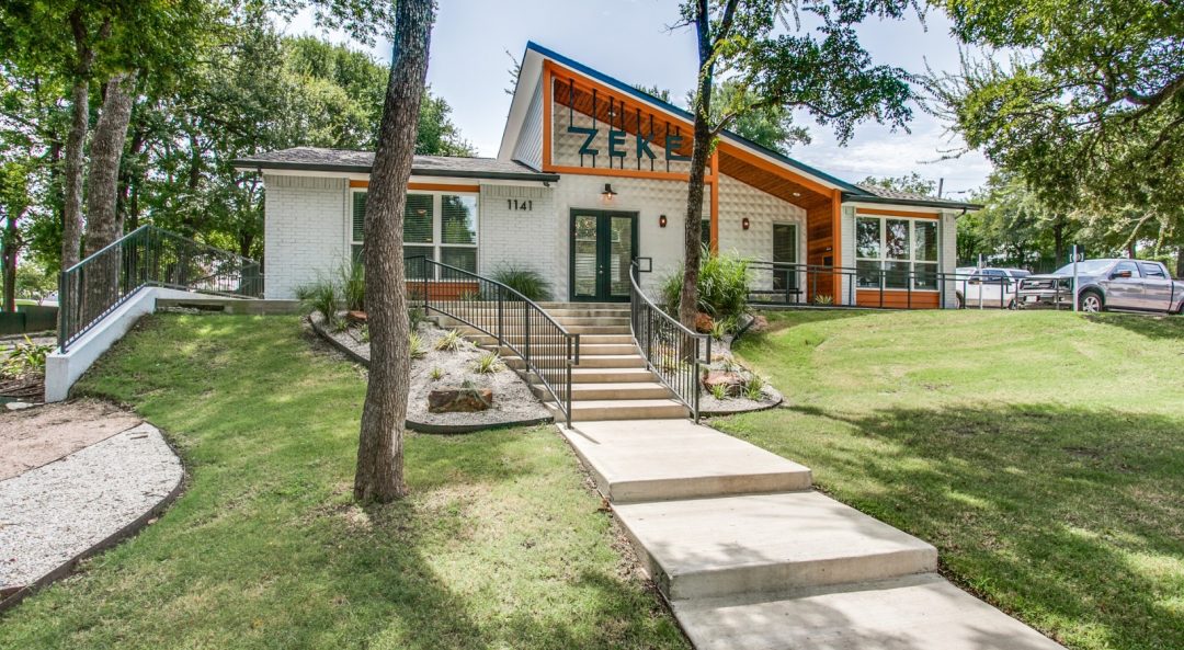 a home with a large yard and a walkway at The Zeke