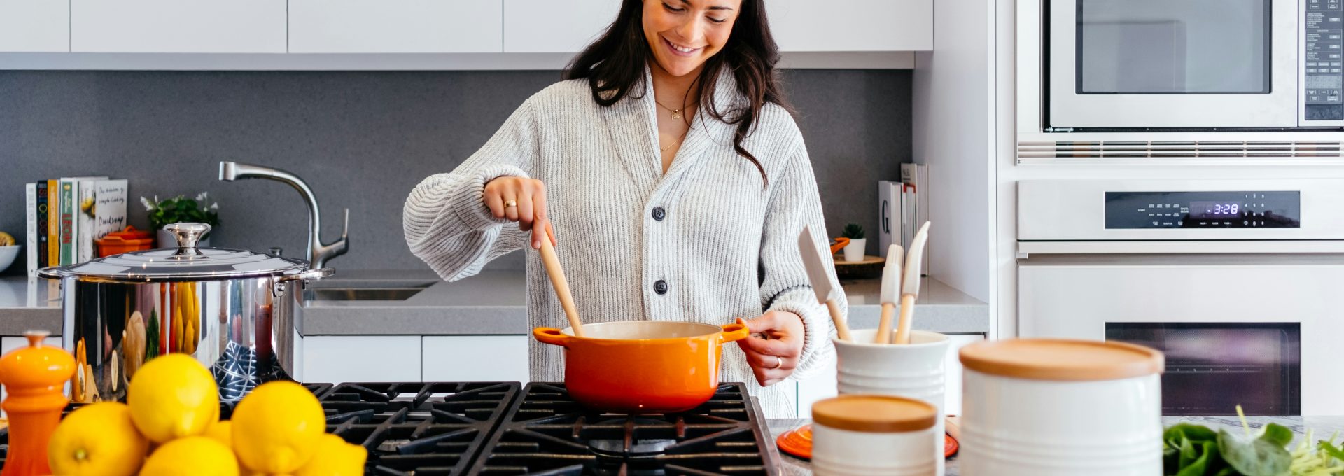 woman cooking inside kitchen room